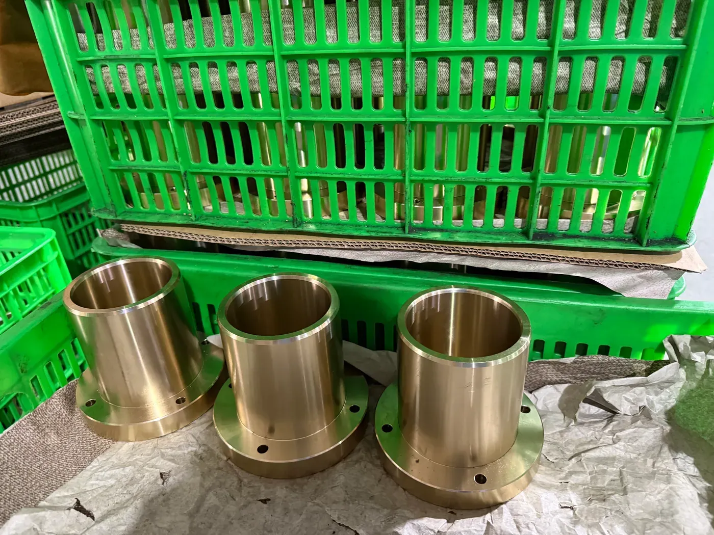 Small flanged bronze bushings after machining